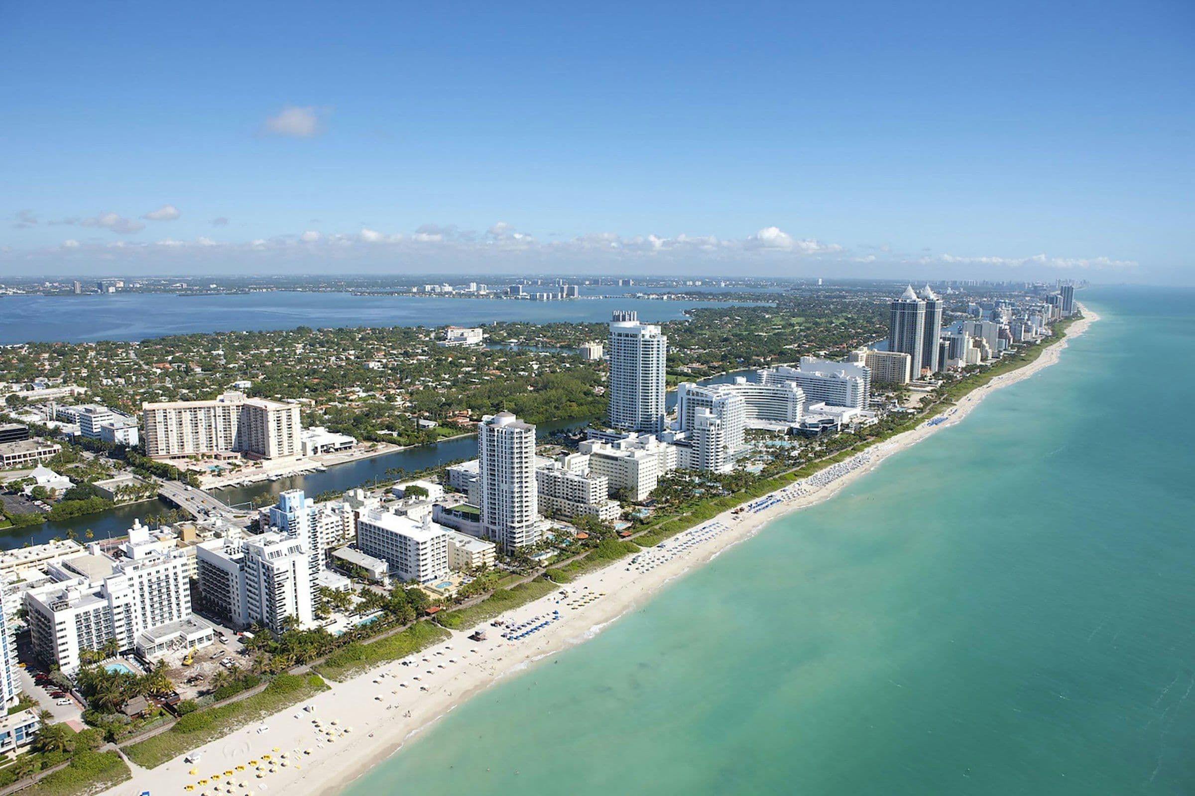 Aerial view of the Miami Beach shoreline and condominium towers
