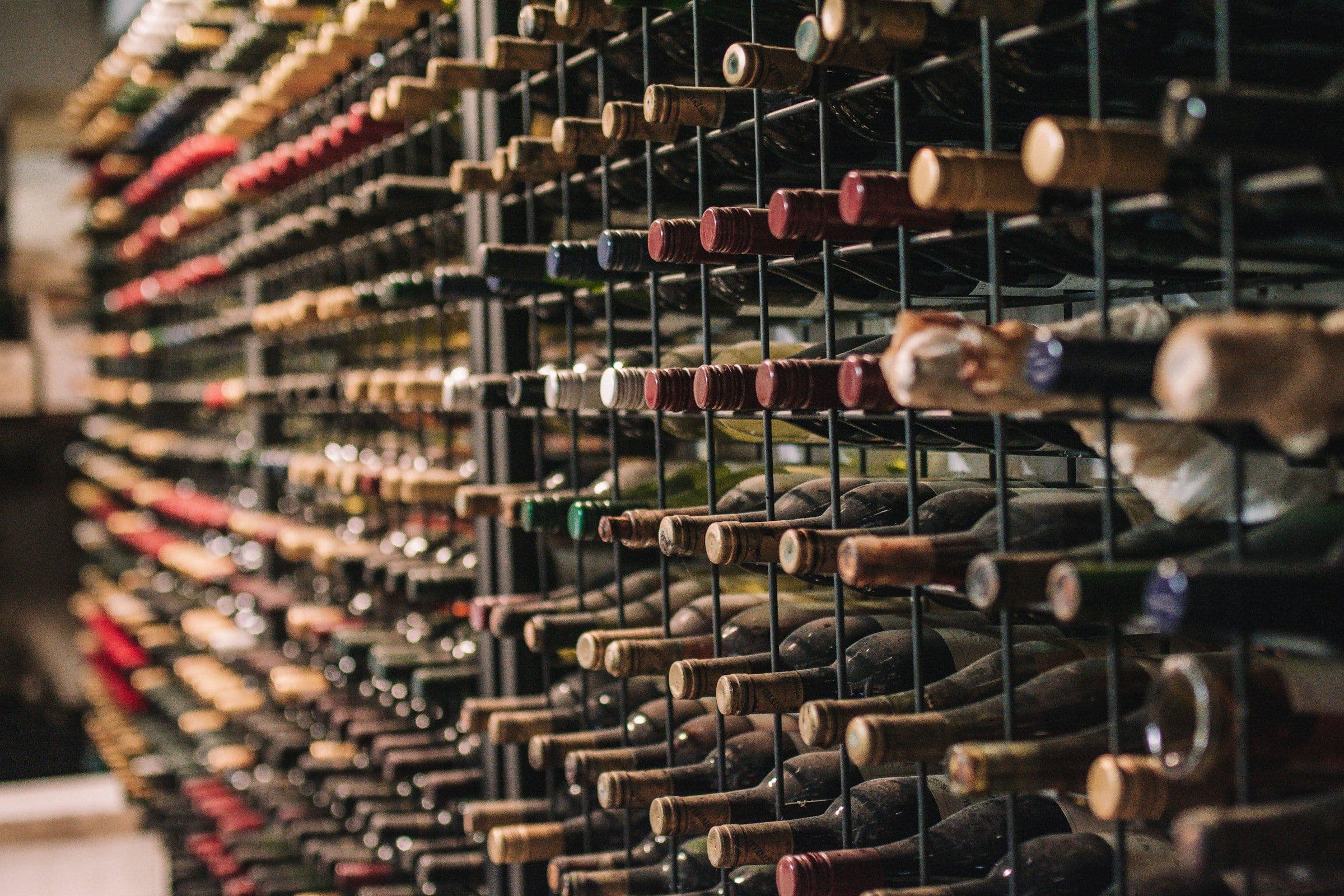 Wall of wine bottles in a modern metal rack