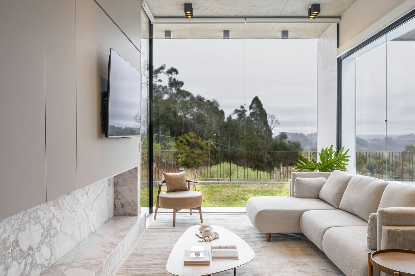 Full-height glass wall in a contemporary living room