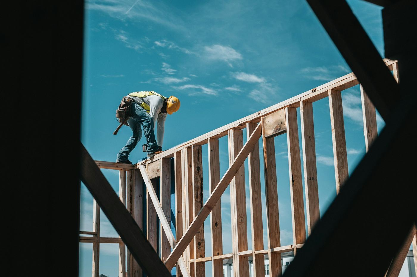 Builder working on the framing of a new home