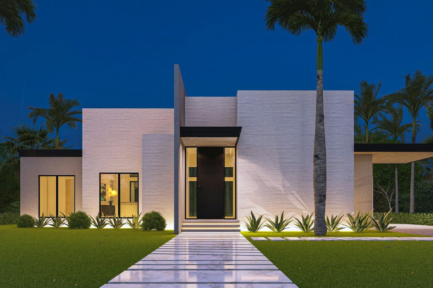Modern home with a glass entry door and palms at night